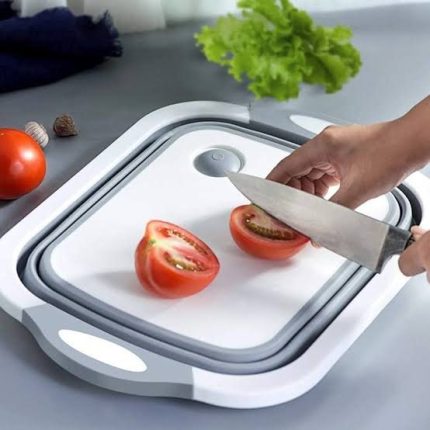Collapsible silicone chopping board with integrated drainage, designed for cutting and rinsing food, and easy storage in Lagos Nigeria