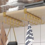 Metal over-cabinet or wardrobe hanger for organizing towels, bags, or clothes in Lagos Nigeria