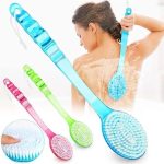 Long handheld bath brush with wooden handle and soft bristles for body cleansing in Lagos Nigeria