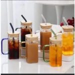 Drinking glass cup with bamboo lid and reusable straw in Lagos Nigeria